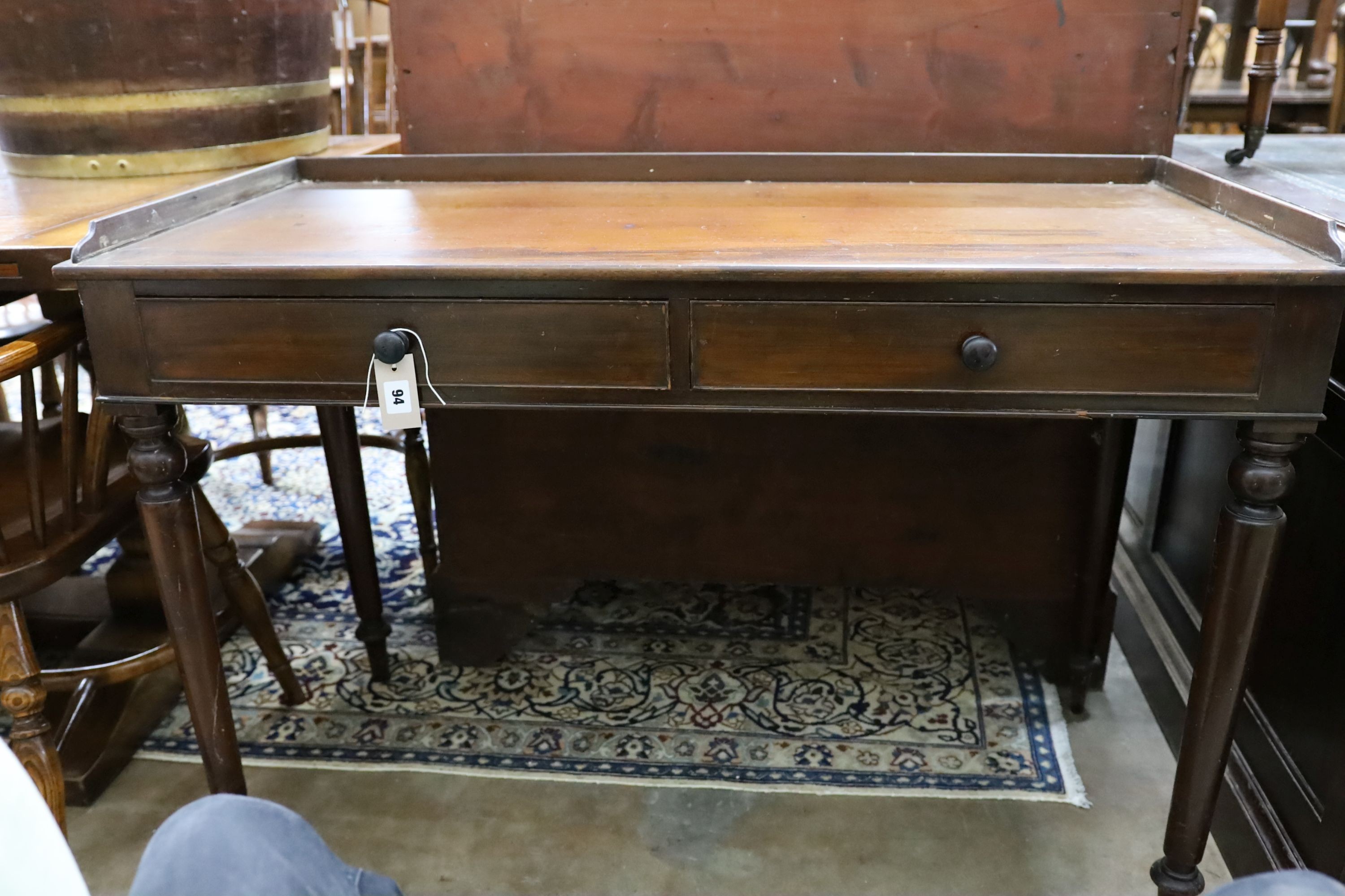 An early Victorian mahogany washstand, with a three quarter galleried top, width 115cm, depth 53cm, height 79cm